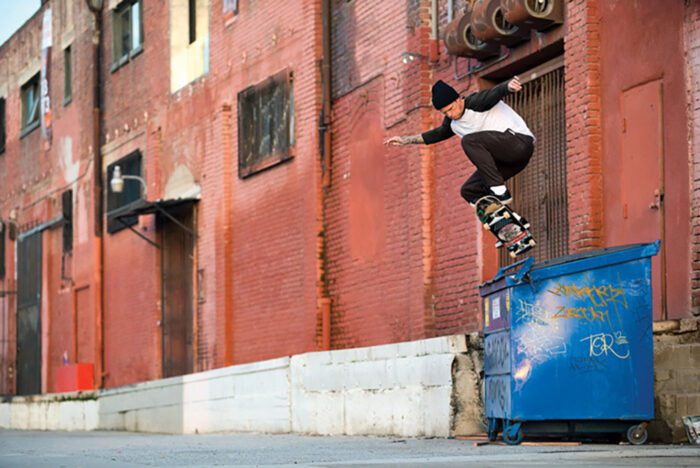 Anthony Van Engelen pops out of backside 5050 a blue dumpster. photo: Anthony Acosta