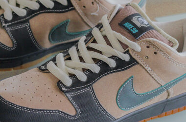 Close up of the Swoosh and tongue detailing on the Nike SB x Slam City Dunk