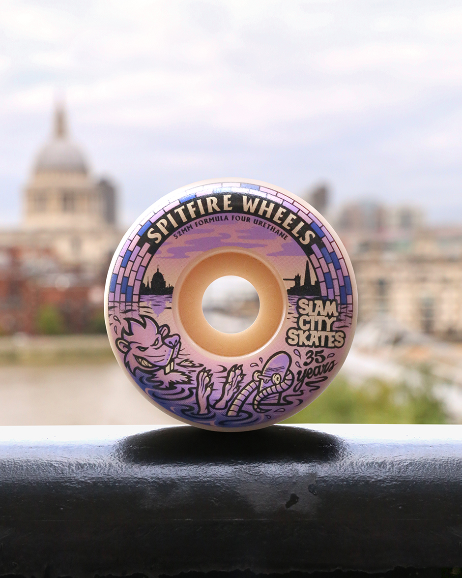 Our Spitfire x Slam City Skates Formula Fours pictured in front of the skyline the wheel contains