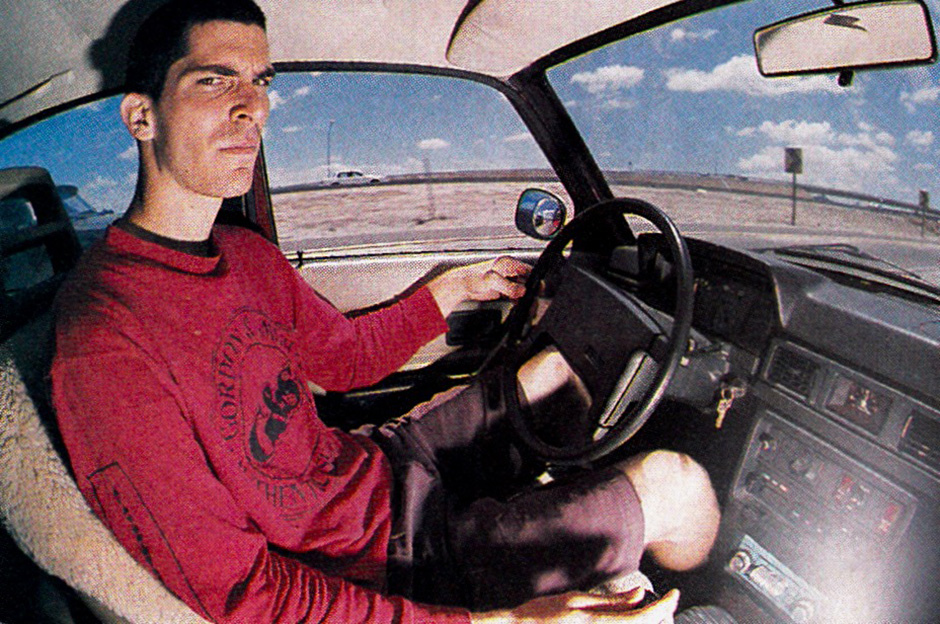 Neil Blender driving his Volvo in 1989 shot by O