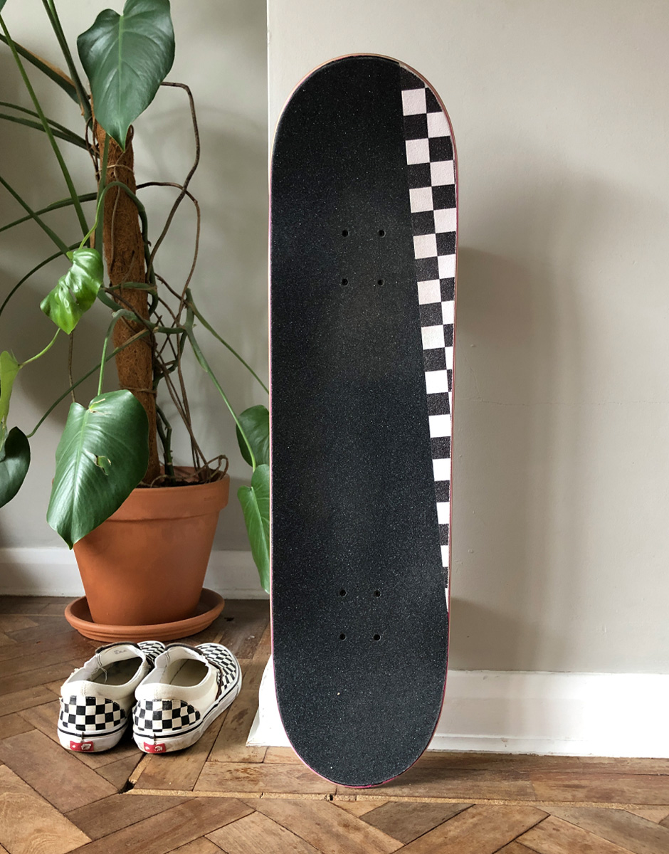 Some checkerboard flare courtesy of Jessup griptape and the Descent Skateboards equivalent of Shorty's bolts finish the job