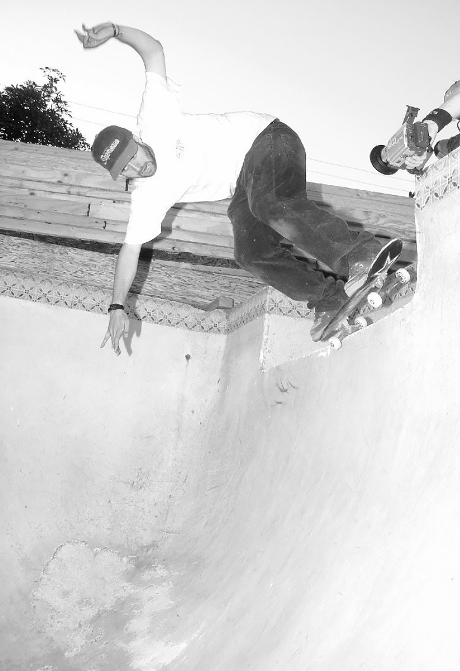 Seth backside pivots in a backyard pool in LA. Jay Doherty captures the moment