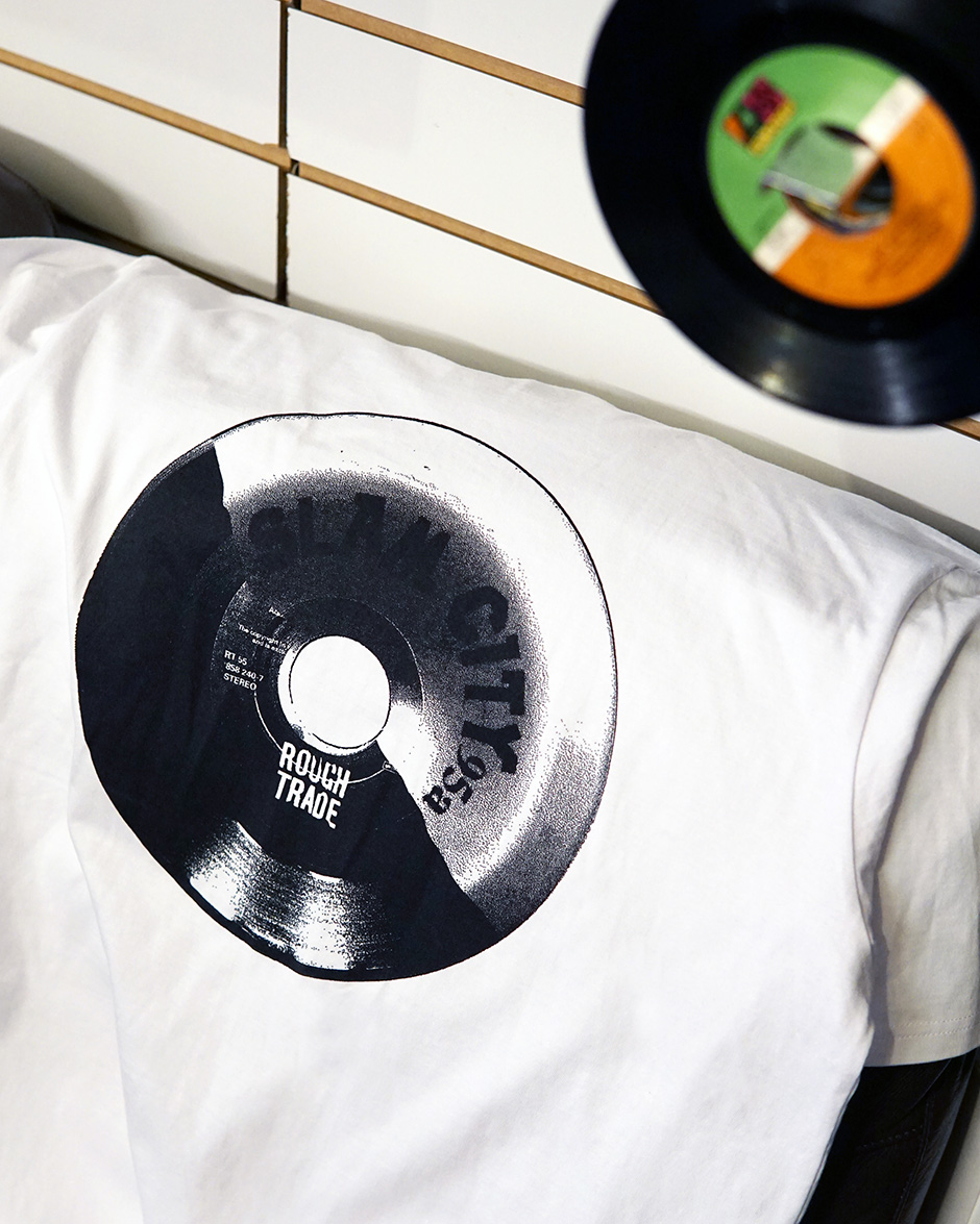 The backprint of the white Slam City Skates X Rough Trade T-Shirt