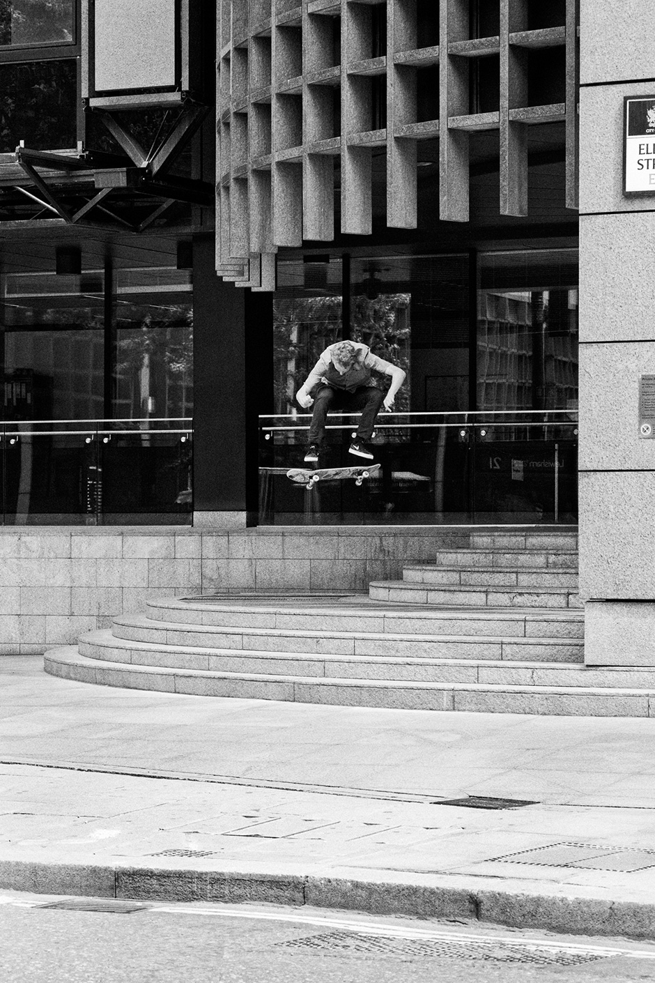 Neil Smith's first attempt at nollie heelflipping the Liverpool Street double set. Shot by Henry Kingsford