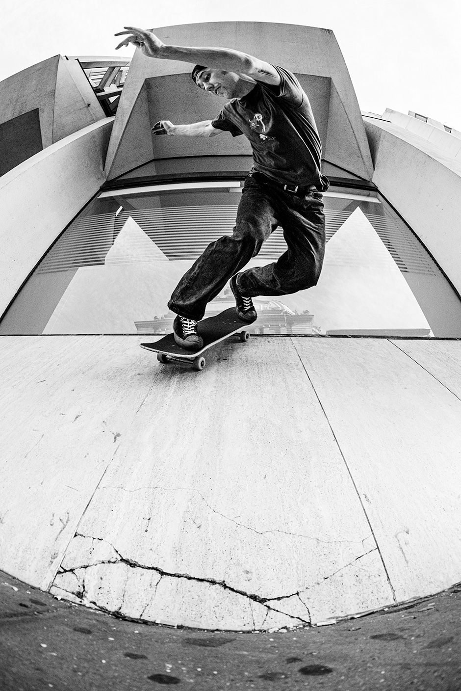 Billy Trick does a backside slas while out and about, Rich West enjoys the freedom of no flashes to frame Billy perfectly