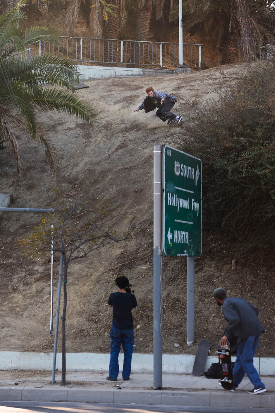 Aidan Mackey tail drop into a dirt mountain near Echo Park. Photo shot by Ben Colen and selected for his Slam City Skates 5000 Words interview