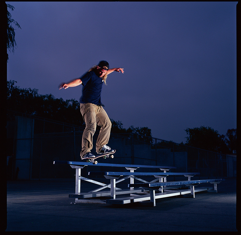 Anthony Van Engelen switch backside nosegrinds the top of a bleacher for Ben Colen's lens in 2003. This trick appeared in the Habitat 