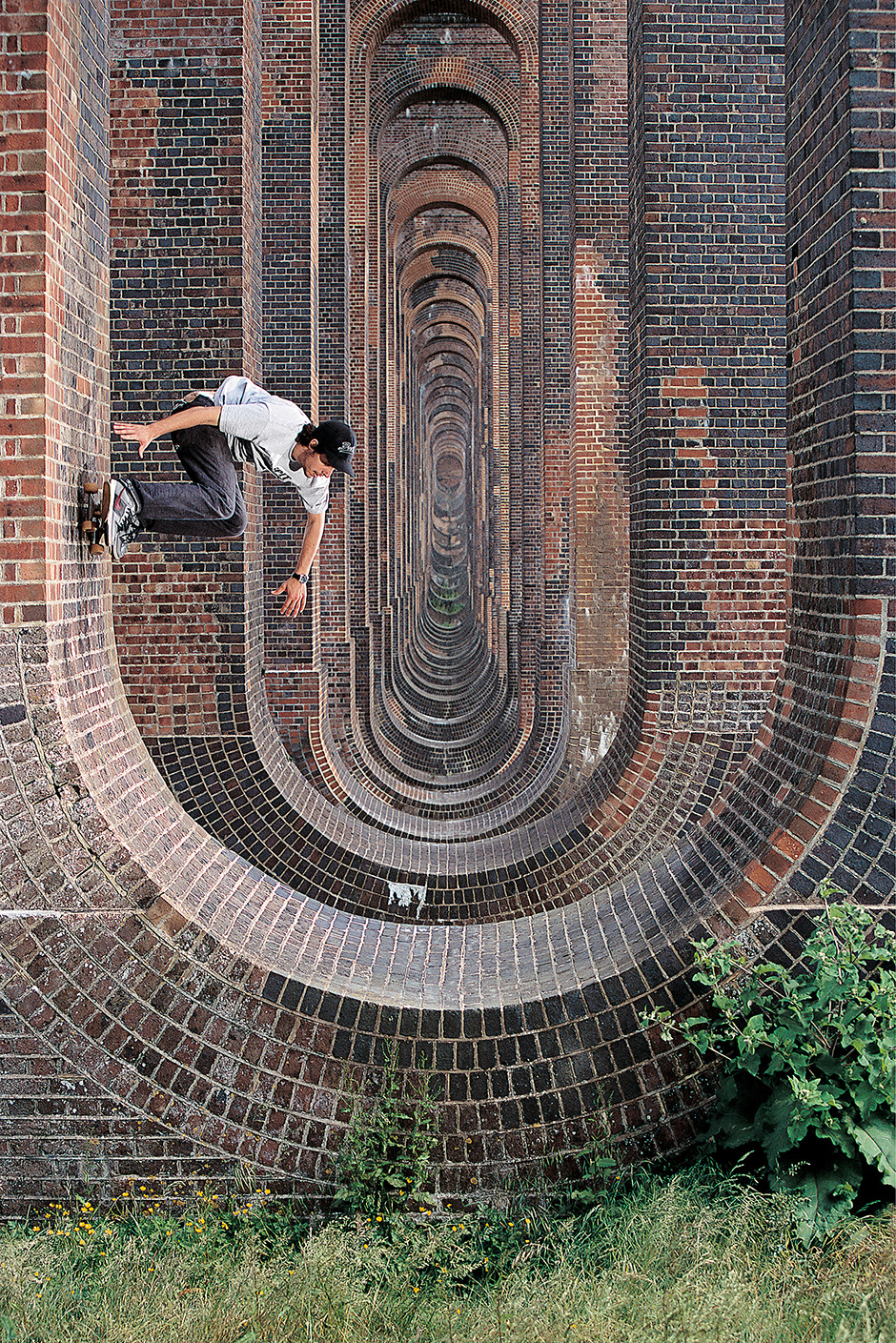 Laurie Sherman with a lofty backside carve in the viaduct. Photo shot by Richie Hopson and selected for his Slam City Skates 5000 Words interview