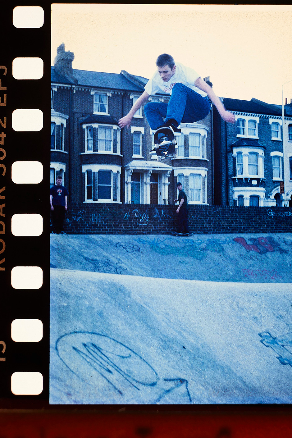 Matt McMullan blasting an ollie over the hip over Stockwell's original surface. Photo shot by Richie Hopson and selected for his Slam City Skates 5000 Words interview