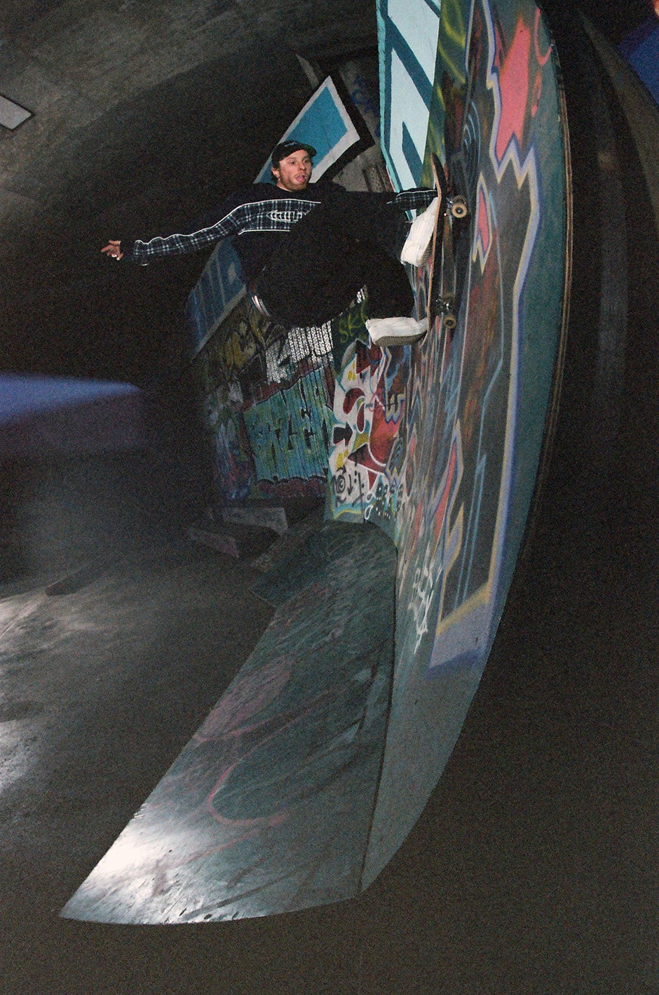 Tom Delion reaching the peak of a frontside wallride for Rafski's lens