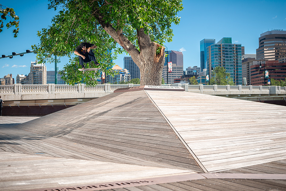 Andrew Reynolds with a picture perfect signature frontside flip against the Calgary skyline. Photo shot by Kyle Seidler and selected for his Slam City Skates 5000 Words interview