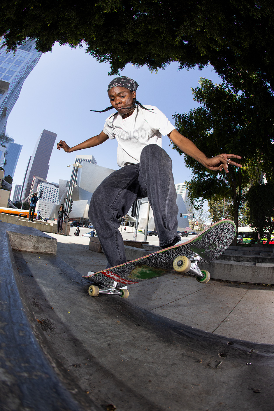 Beatrice Domond frontside 5-0s in Los Angeles in front of the Walt Disney Centre. Photo shot by Atiba Jefferson and selected for his Slam City Skates 5000 Words interview
