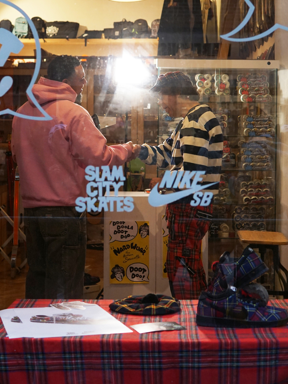Nardwuar and a customer shot from outside Slam City Skates