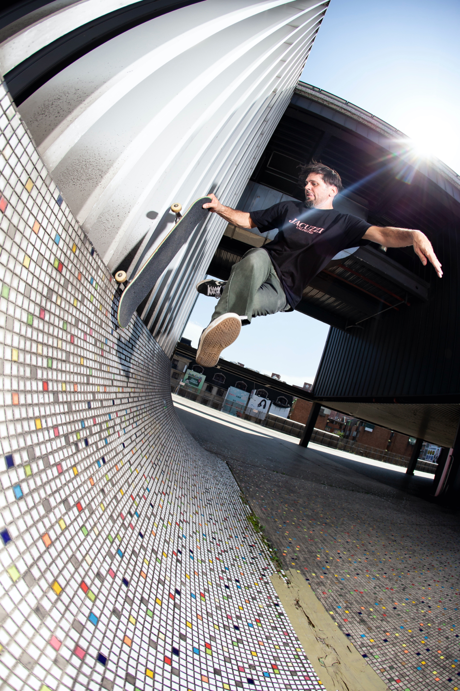 Louie Barletta lets his feet airwalk in Asia on a Jacuzzi tour, shot by Jeff Davis