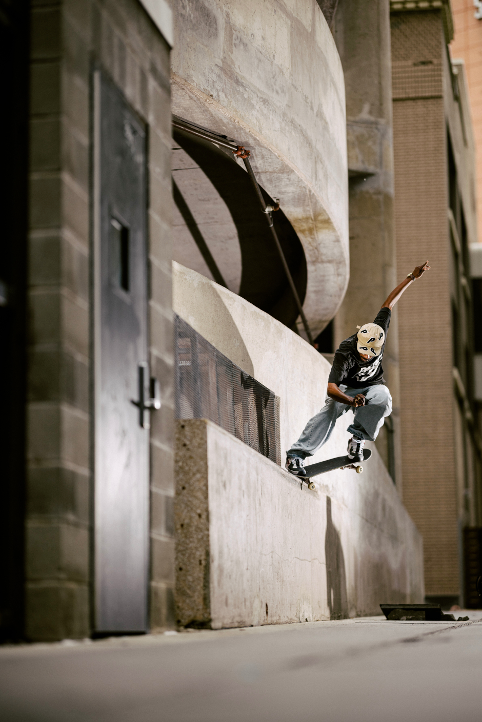 Jahmir Brown crooked grinds a tall texan ledge with a bump assist shot by Mike Heikkila