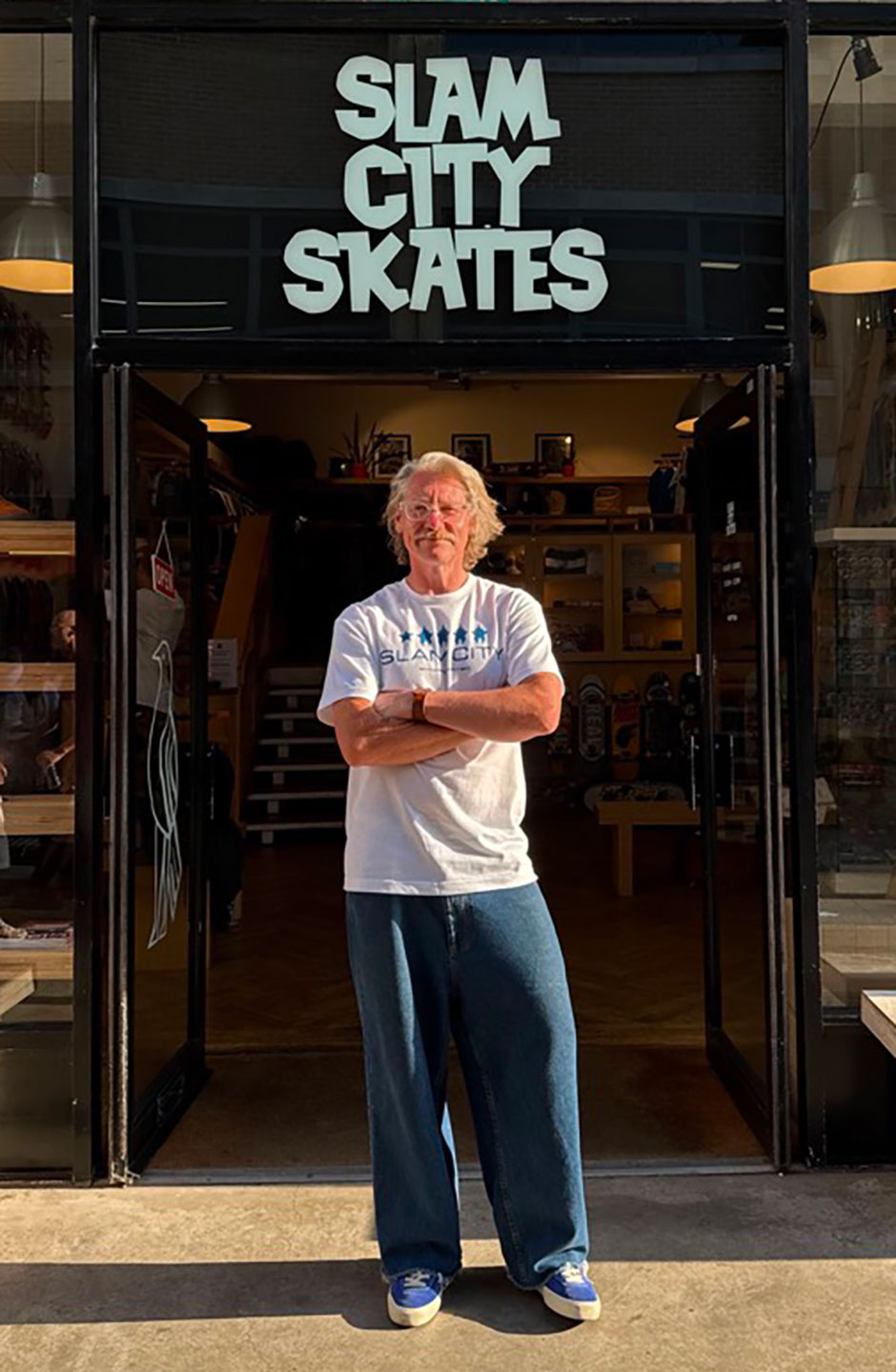 Chris Pulman outside the Slam shop with his first official package
