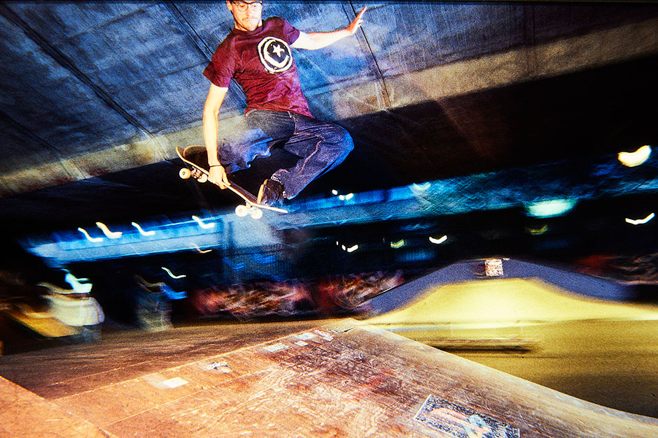 Chris Pulman contorts a tuck knee at Playstation Skatepark shot by Richie Hopson